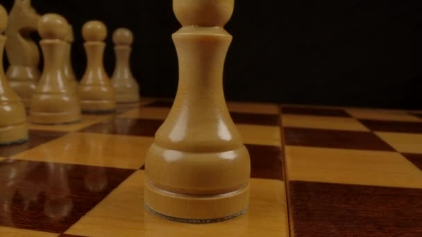 Pawn - chess figure. Wide-angle macro-shooting on a chessboard — Stock Video