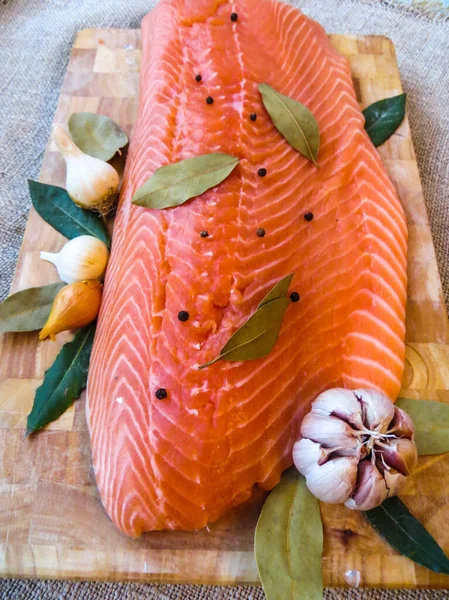 Salmon filet with bay leaf and spices — Stock Photo, Image