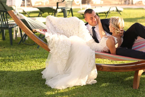 Joyful bridal couple embracing — Stock Photo, Image