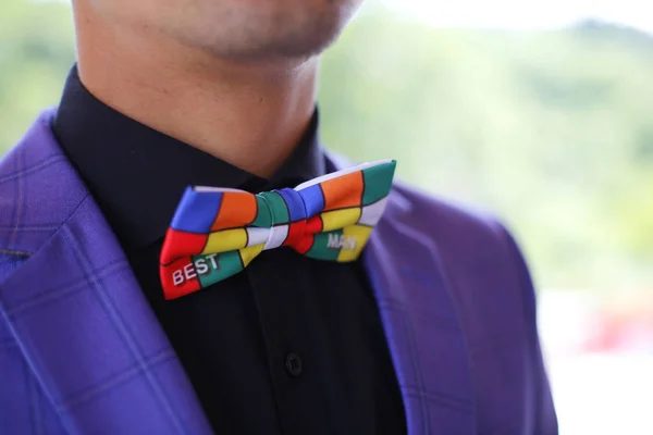 Best man with a colored bow tie