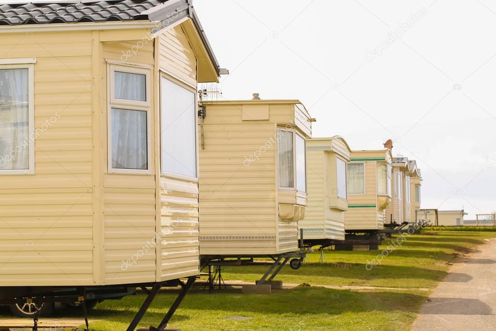 White caravan houses in a row