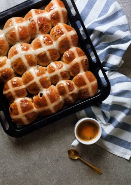 Homemade Hot Cross Buns and coffee Ready for Easter morning brea clipart