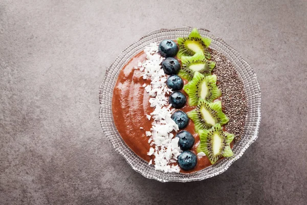 Chocolate banana Smoothie bowl  topped with blueberries, kiwi , — Stock Photo, Image