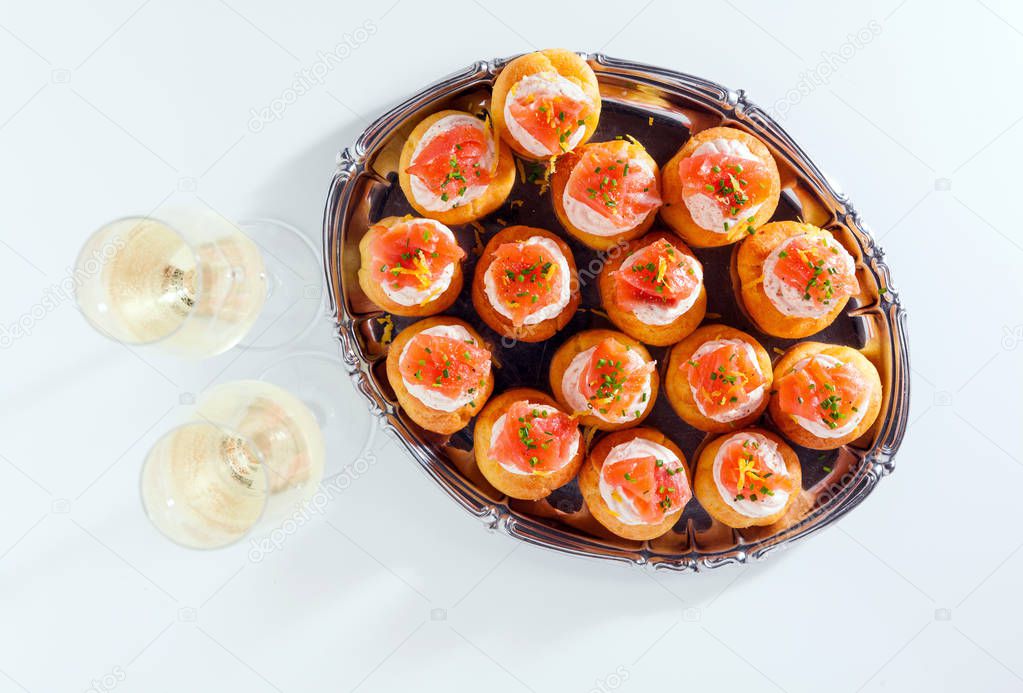 Salmon and creamcheese puffs . Pastries  and champagne. holiday 