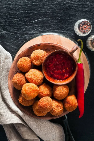 Potato croquette with spicy hot peppers sauce. bar appetizer — Stock Photo, Image