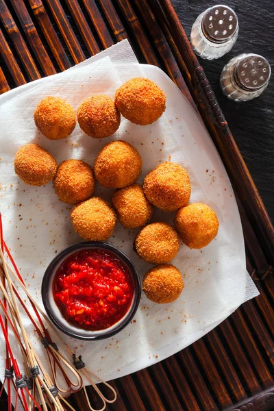 Traditional italian fried balls of mozzarella with spicy souce. — Stock Photo, Image