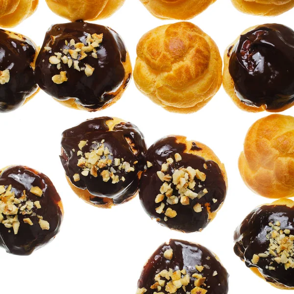 Profiterole with cioccolate on white — Stock Photo, Image