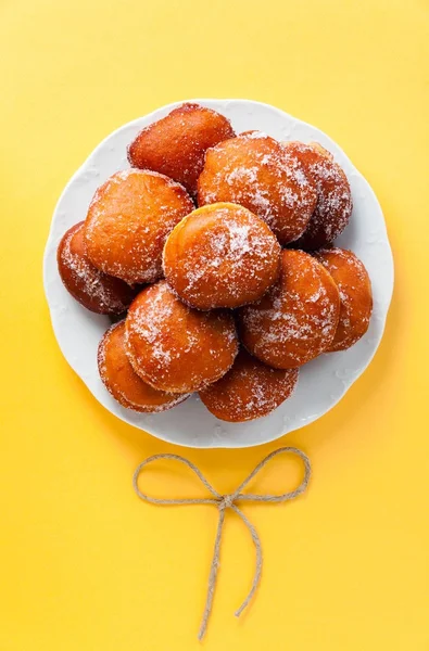 Donuts filled with jam, marmalade or cream on a plate — Stock Photo, Image