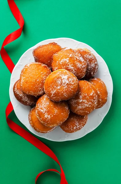 Donuts filled with jam, marmalade or cream on a plate — Stock Photo, Image