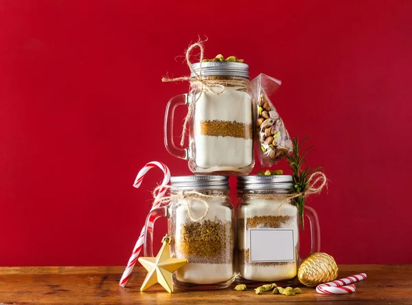 mix of flour, sugar, nuts for baking in a jar . Christmas mood t
