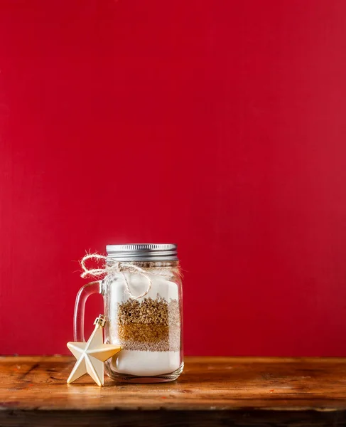 mix of flour, sugar, nuts for baking in a jar . Christmas mood t