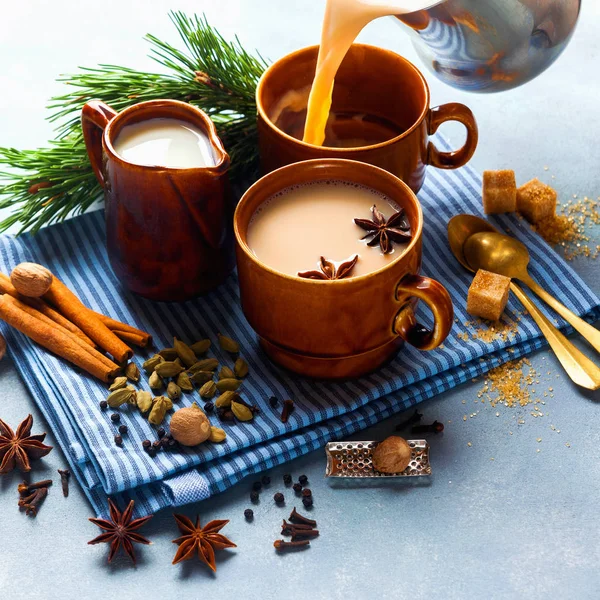 Pouring Masala tea chai latte traditional hot Indian teatime cer — Stock Photo, Image