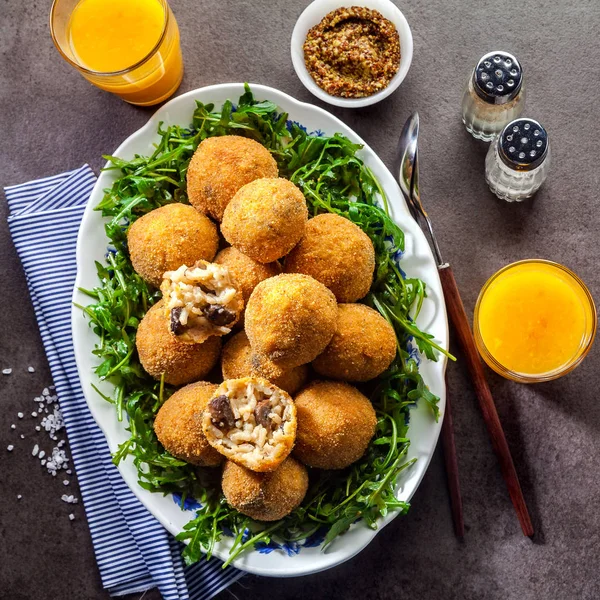 Italian snack. Fried balls from rice Arancini with mushrooms, ch — Stock Photo, Image