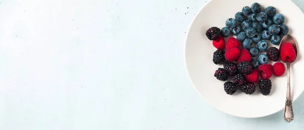 Fruit salad with Various fresh summer berries in white plate . T — Stock Photo, Image