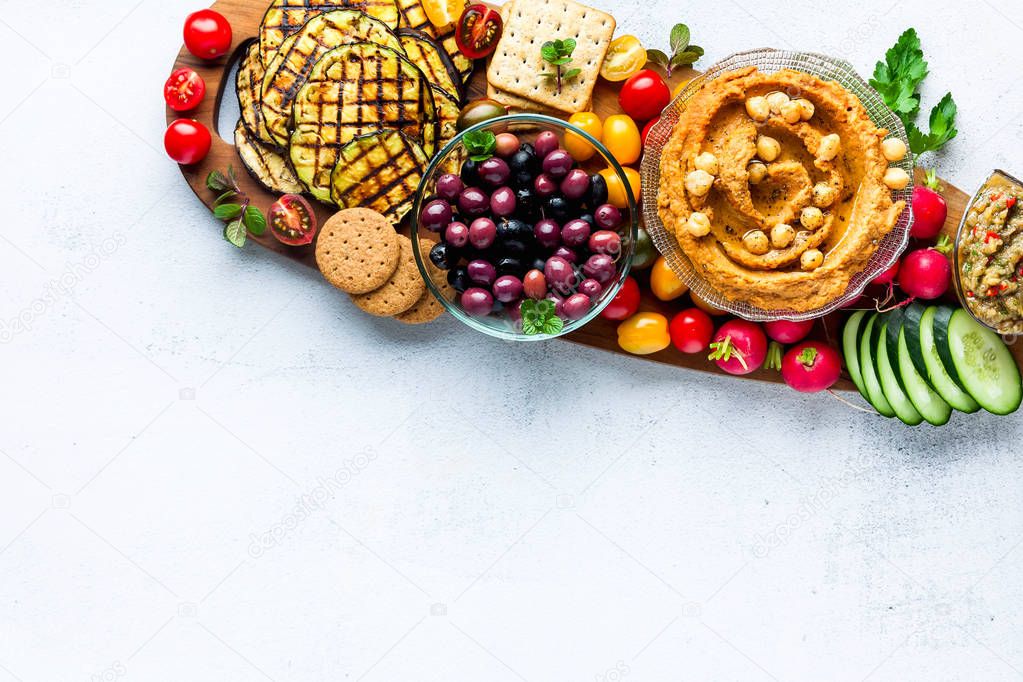 Vegan snack board. Flat-lay of Various Vegetarian dishes  hummus