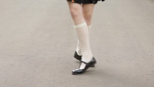 Dancers legs close-up. Girl wearing white knee socks and black skirt dancing solo jazz swing dance. Charleston dance. — Stock Video