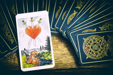 taro cards on wooden background