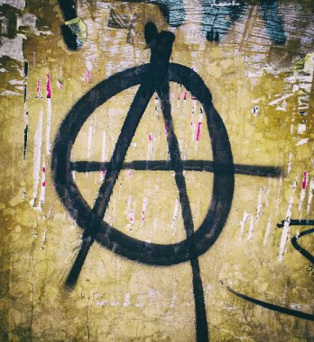 Anarchy symbol on dirty painted wall. clipart