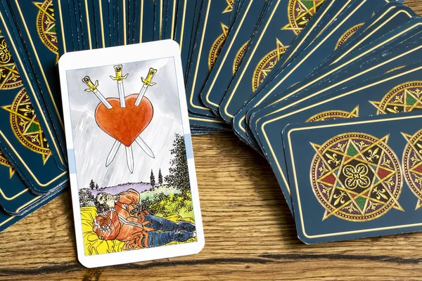 taro cards on wooden background