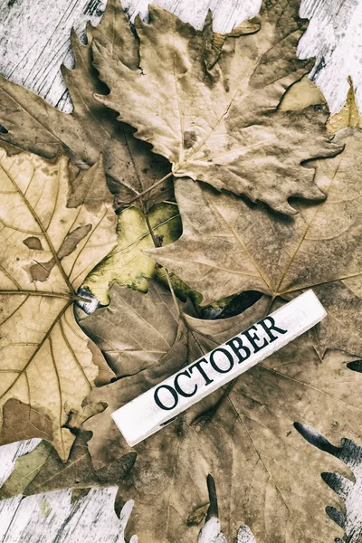 Inscription October Autumn Leaves Wooden Background — Stockfoto