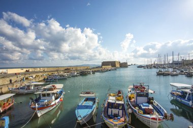 boats in the port with cloudy sky