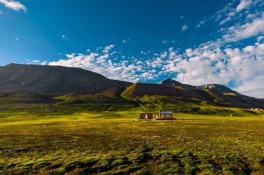 Wallpaper norway landscape nature of the mountains of Spitsbergen Longyearbyen Svalbard building city on a polar day with arctic summer in the sunset and blue sky with clouds clipart