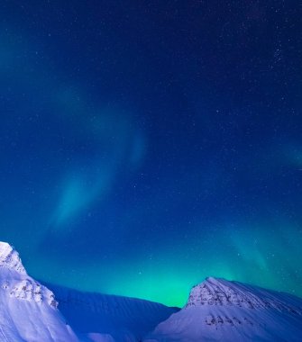 The polar arctic Northern lights aurora borealis sky star in Norway Svalbard in Longyearbyen city the moon mountains clipart