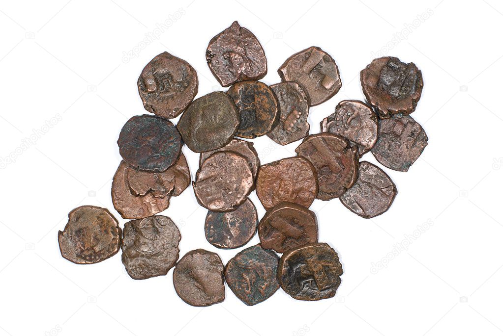 Many ancient bronze coins on over white