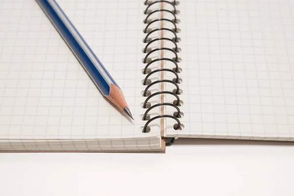 Pencil on the pages of an open notebook for records — Stock Photo, Image