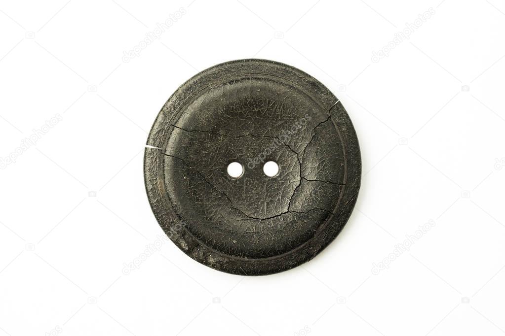 The old Round button with cracks on white