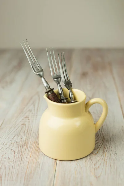 Three forks stick out of the jug — Stock Photo, Image