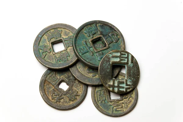 Ancient Chinese bronze coins on white background — Stock Photo, Image