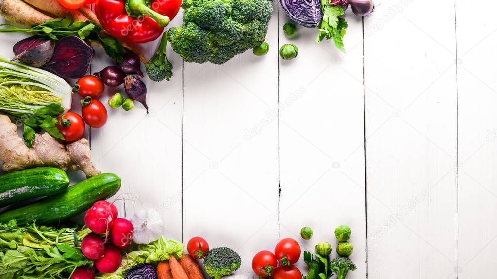 Big set organic food. Fresh raw vegetables. On a white chalkboard.