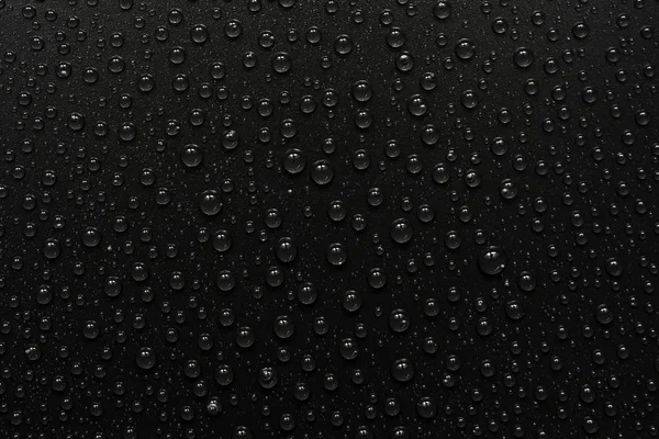 Gotas de água no fundo preto. Macro . — Fotografia de Stock