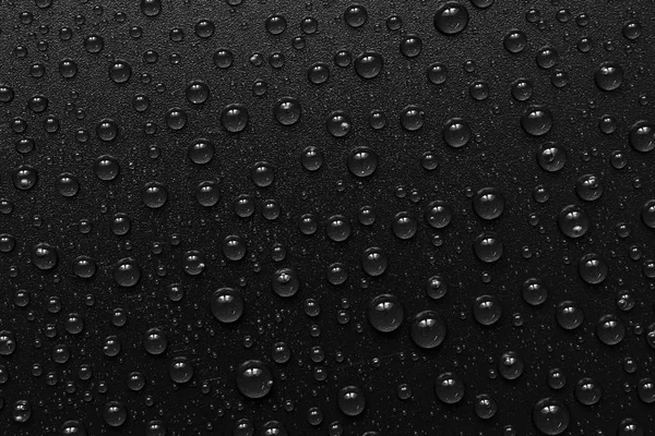 Gotas de agua sobre fondo negro. Macro . — Foto de Stock