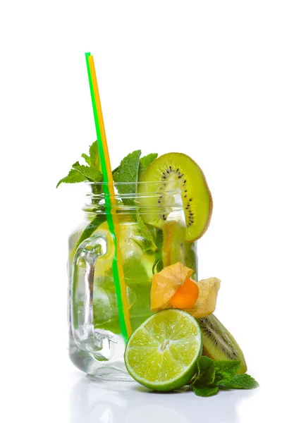 A fresh cocktail of tropical fruit and juice with ice. Fresh fruit lime, lemon, mint, kiwi. Top view. On a white background. — Stock Photo, Image