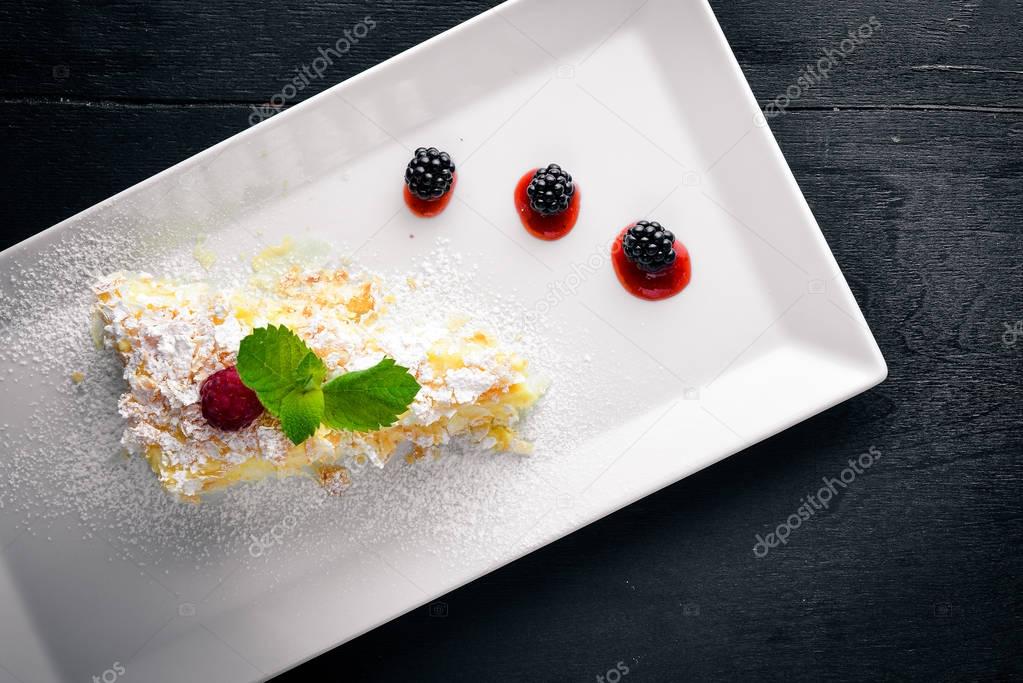 Puree Cream Cake. On a wooden background. Top view. Free space for your text.