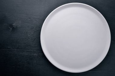 Plaka. Ahşap bir arka plan üzerinde. Üstten Görünüm. Metniniz için boş alan.