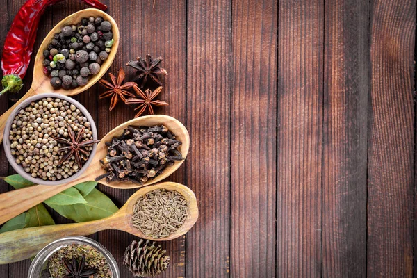 Mixture of spices in Wooden spoons — Stock Photo, Image