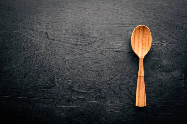 Siyah zemin ahşap tahta kaşık.