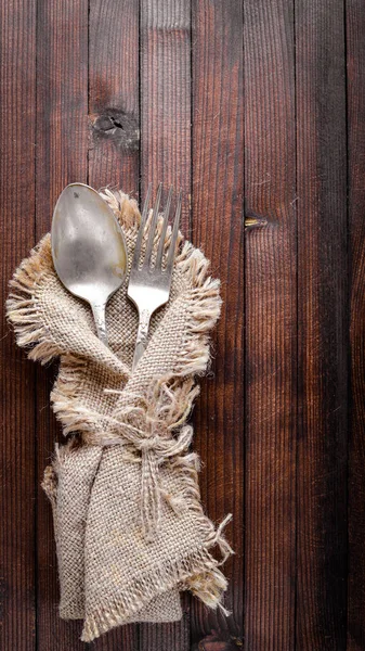 Old cutlery. On Wooden background. Top view.