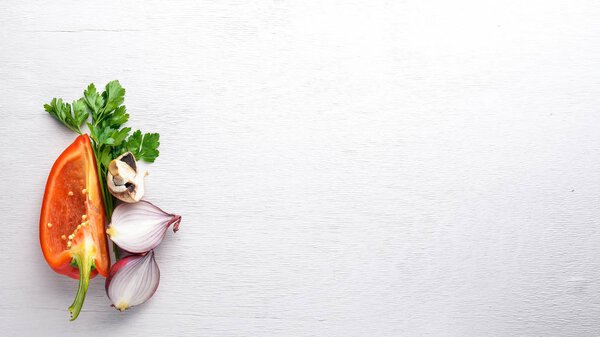 Fresh vegetables. Preparation for cooking. On a wooden background. Top view. Free space.