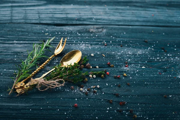 Preparation for cooking. Old cutlery. On a wooden surface. Top view. Free space for your text.