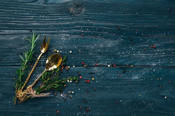 Preparation for cooking. Old cutlery. On a wooden surface. Top view. Free space for your text.