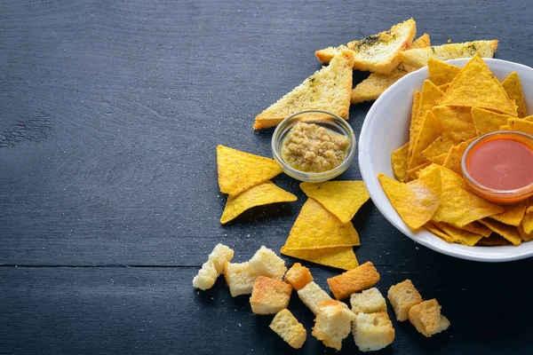 Snack for beer. Chips On a wooden background. Top view. Free space for your text. — Stock Photo, Image