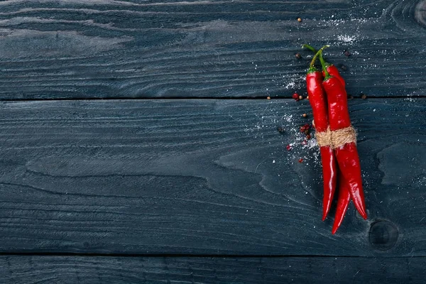 Chili red pepper. On a wooden background. Top view. Free space for your text. — Stock Photo, Image