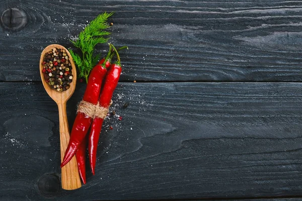 Hot spices Chili and Spice Red Peppers. On a wooden background. Top view. Free space for your text. — Stock Photo, Image