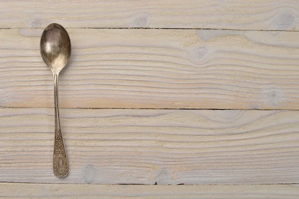 Old cutlery. On a wooden background. Top view. Free space for text.