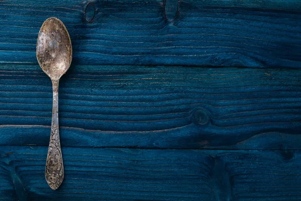 Old cutlery. On a wooden background. Top view. Free space for text.