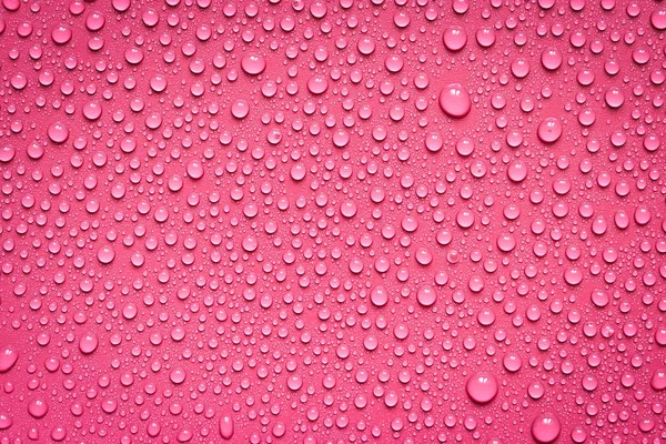 Gotas Agua Sobre Fondo Rojo —  Fotos de Stock